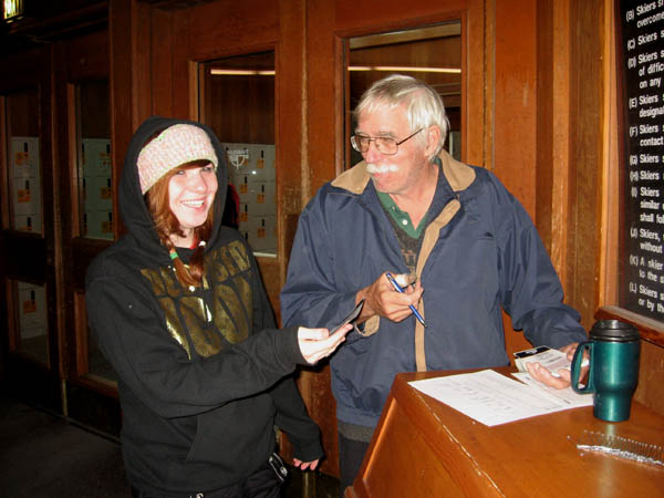 Camp Director Mike hands out lift tickets