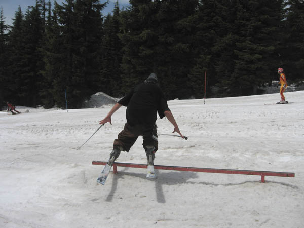 Nolan Willard does double ski pole rail trick