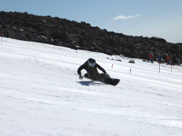 snowboarder carving up the palmer snowfield